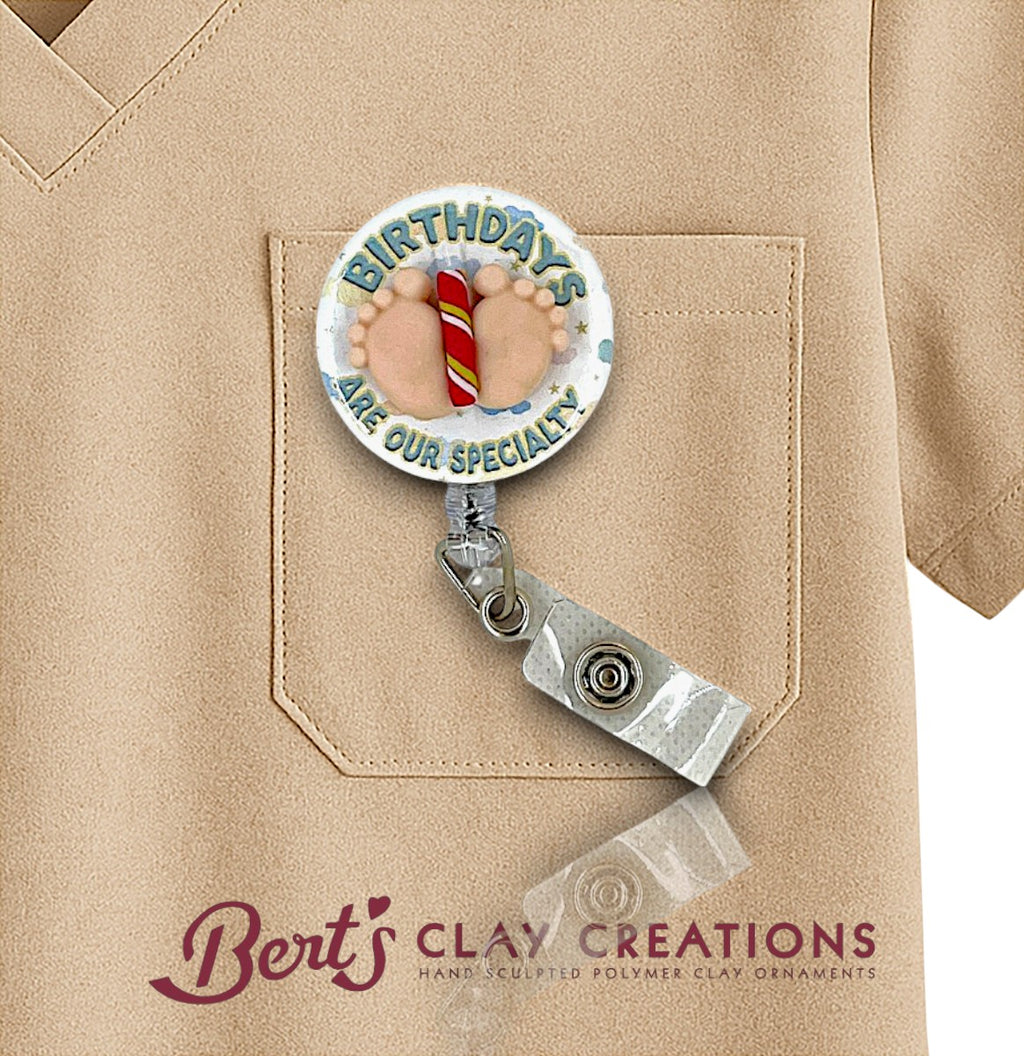Retractable badge holder with birthday design on a beige shirt, featuring 'Bert's Clay Creations' branding.