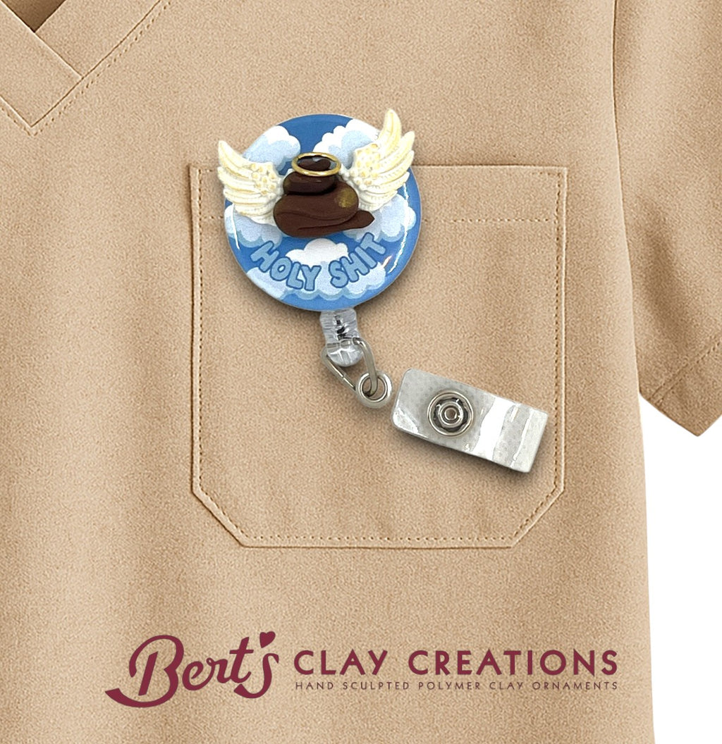 Badge holder with decorative design on a beige shirt, featuring 'Bert's Clay Creations' logo.