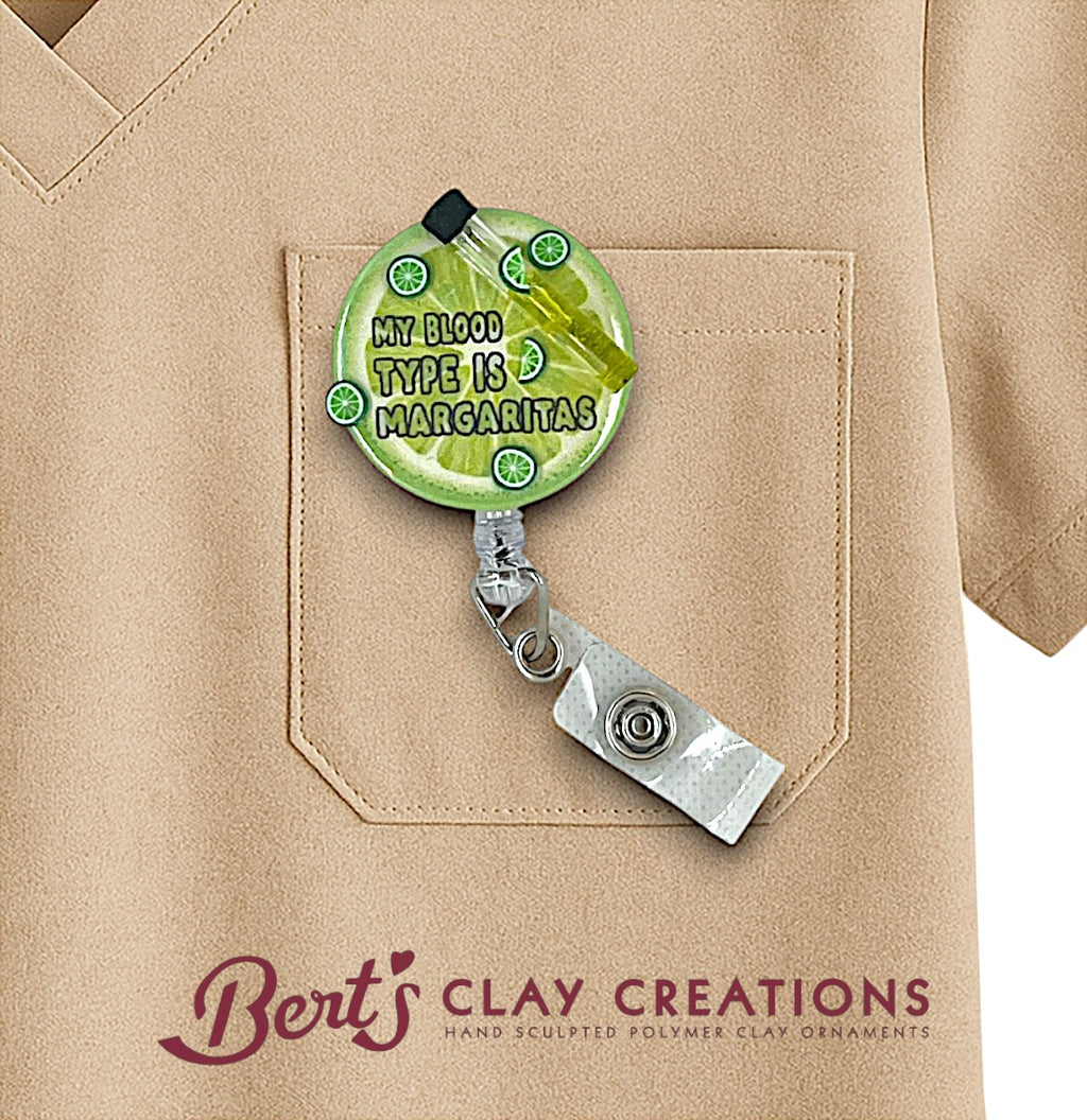 Margarita themed funny interchangeable badge holder with text on a beige shirt, featuring 'Bert's Clay Creations' branding.