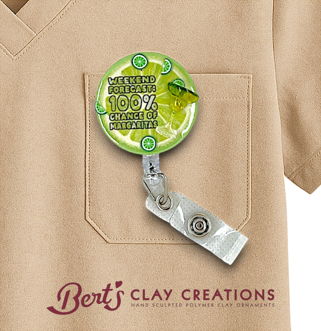 Badge holder with lime design and text on a beige shirt, featuring 'Bert's Clay Creations' branding.