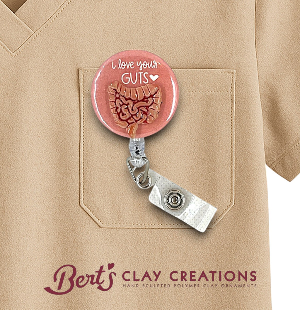 Gastroenterologist or GI doctor themed Retractable badge holder with 'I love your GUTS' design on a beige shirt, featuring Bert's Clay Creations branding.