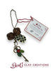 Vintage-style key with festive clay holly, jingle bells, and a tag reading “Santa’s Magic Key,” perfect for homes without chimneys.