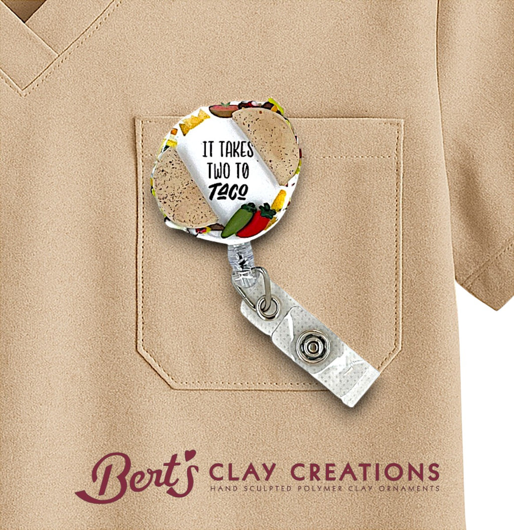 Badge holder with 'It Takes Two to Taco' design on a beige shirt, featuring Bert's Clay Creations branding.
