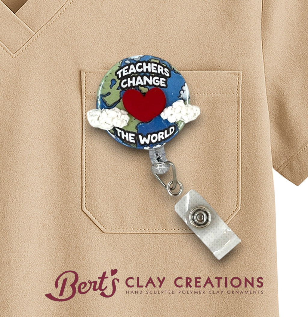 Badge holder with 'Teachers Change the World' design on a beige shirt, featuring Bert's Clay Creations logo.