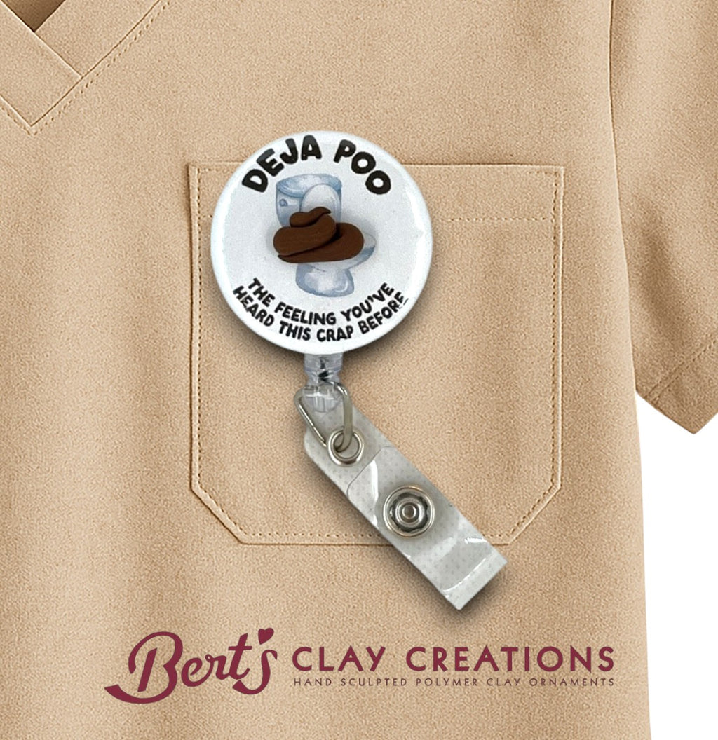 Badge holder with 'Deja Poo' design on a beige shirt, featuring Bert's Clay Creations branding.