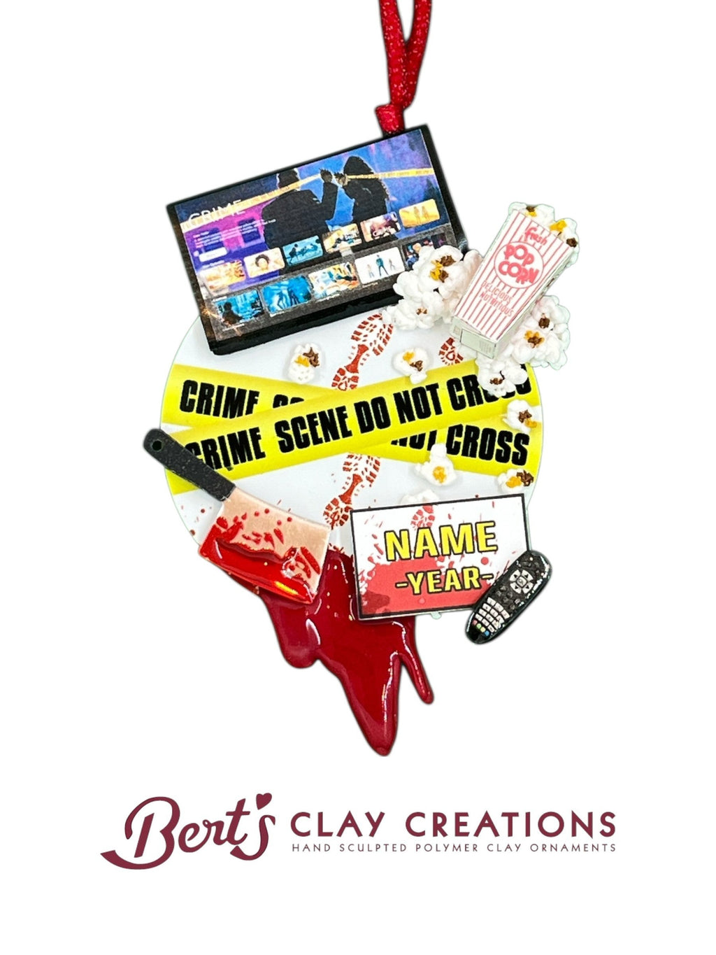 Bert's Clay Creations personalized true crime ornament featuring a TV screen, popcorn, crime tape, and bloody cleaver.