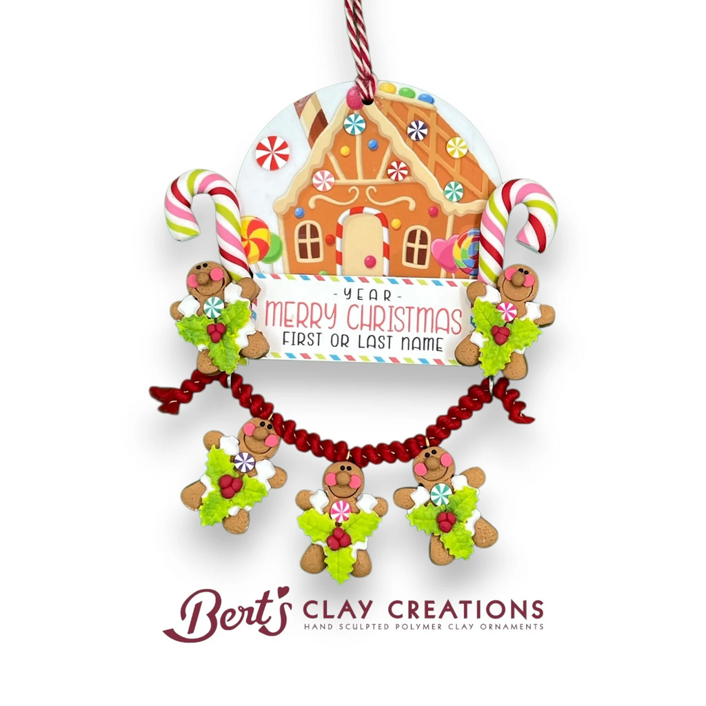 Bert's Clay Creations Gingerbread House Ornament with candy canes, gingerbread people, and customizable Merry Christmas message.